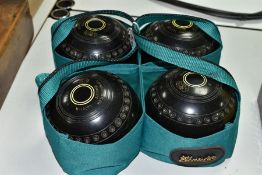 FOUR THOMAS TAYLOR LIGNOID SIZE 4 BOWLS, No M-L4090, have been used but are in fairly good
