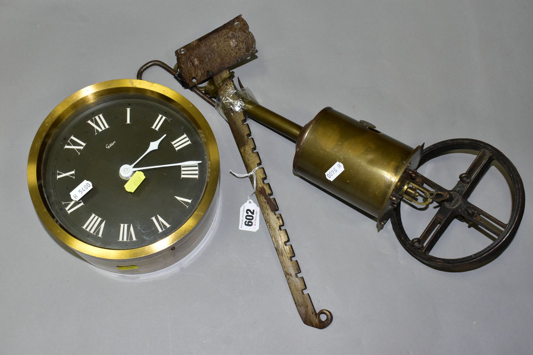 A VICTORIAN BRASS BOTTLE JACK, 'Salters Economical', with bracket, wheel and key, together with a