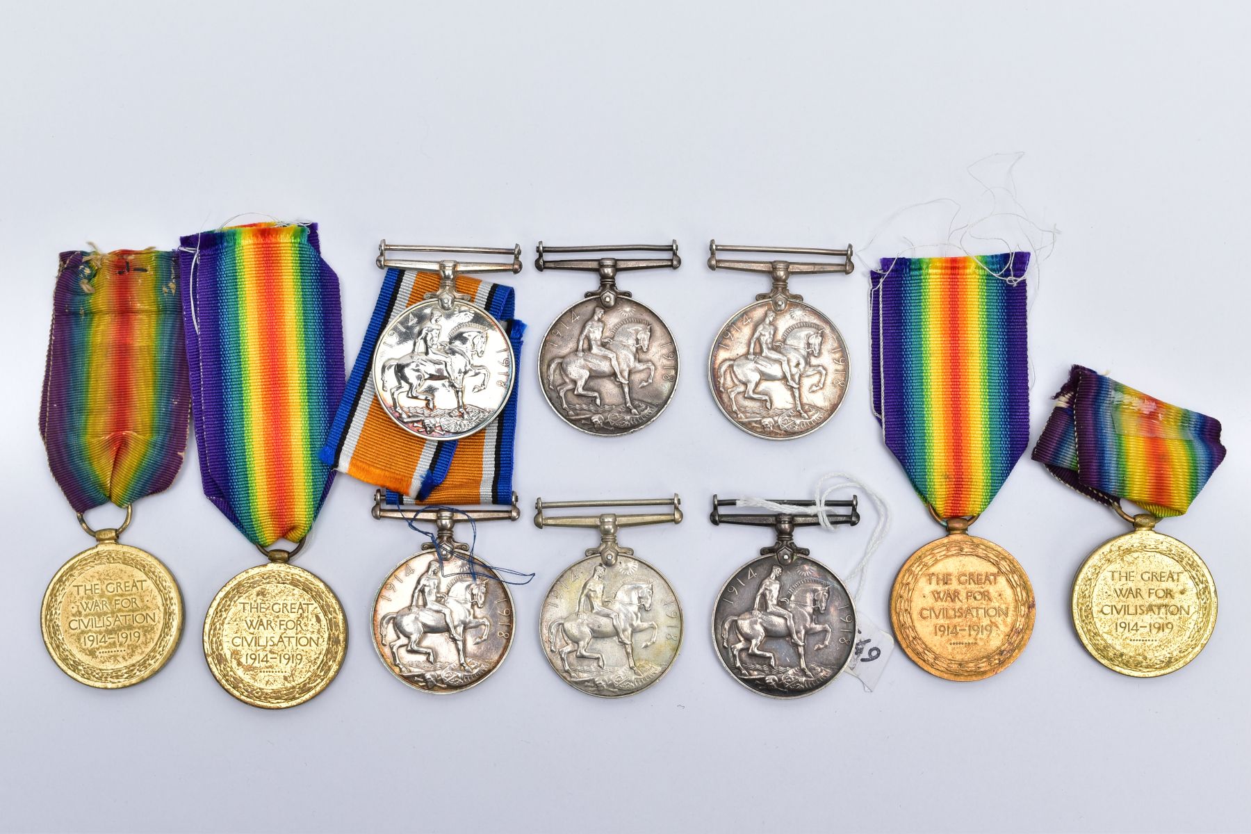 A SMALL COLLECTION OF BRITISH WWI MEDALS, comprising of a British War & Victory medals named J.52444 - Image 5 of 11