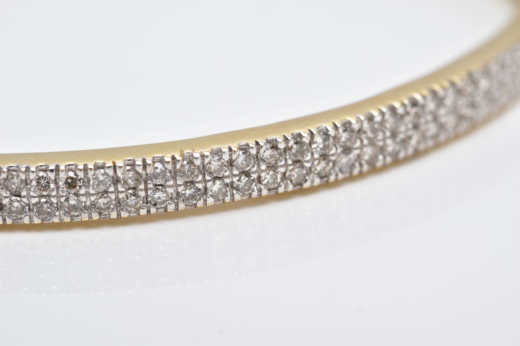 A YELLOW METAL DIAMOND BANGLE, the hinged bangle designed with two rows of round brilliant cut - Image 5 of 6