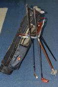 A VINTAGE SHOOTING STICK AND A GOLF BAG CONTAINING A WALKING CANE AND GOLF CLIBS, makes include