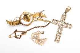 A 9CT GOLD CROSS PENDANT AND A YELLOW METAL BROOCH AND PENDANT, the cross pendant with an openwork