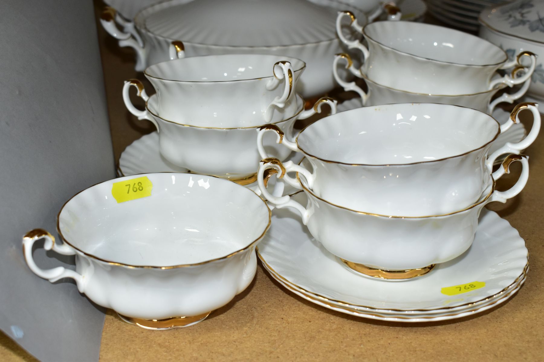 A ROYAL ALBERT VAL D'OR PART DINNER SERVICE, comprising seven soup bowls and six saucers, an oval - Image 5 of 7