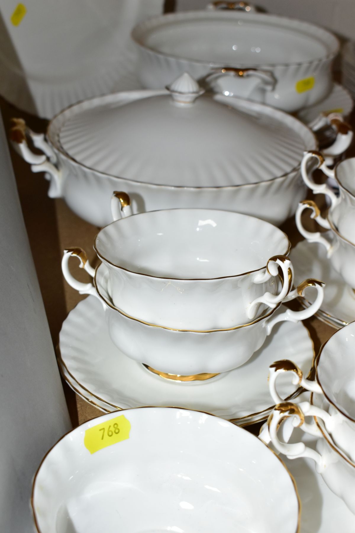 A ROYAL ALBERT VAL D'OR PART DINNER SERVICE, comprising seven soup bowls and six saucers, an oval - Image 6 of 7