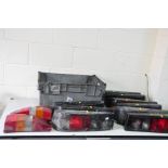 A TRAY CONTAINING FORD SIERRA SMOKED TAILLIGHTS and Ford Escort taillights