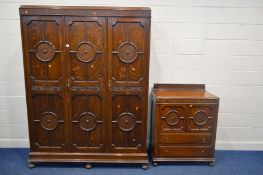AN EARLY TO MID 20TH CENTURY OAK GEOMETRIC TWO PIECE BEDROOM SUITE, comprising a three door