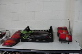 A TRAY CONTAINING SEVEN CAR TAILLIGHTS including Ford Orion, Fiesta Mk3 and Escort Estate Mk5