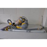 A DYSON DC05 PULL ALONG VACUUM CLEANER with various attachments (PAT fail due to uninsulated plug
