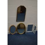 A REPRODUCTION GEORGIAN STYLE WALNUT WALL MIRROR with a shaped top, 38cm x 69cm along with three