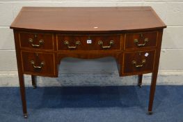 A 20TH CENTURY MAHOGANY AND CROSSBANDED BOWFRONT DESK, in the George III style, with five various