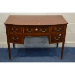 A 20TH CENTURY MAHOGANY AND CROSSBANDED BOWFRONT DESK, in the George III style, with five various