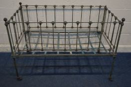 A VICTORIAN METAL COT on casters, 137cm x 37cm x height 94 (one knob missing)