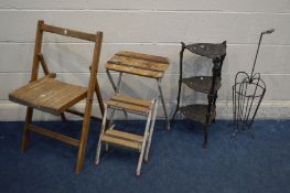 A BLACK PAINTED CAST IRON THREE TIER STAND, along with a metal umbrella stand, a folding beech chair