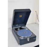 A VINTAGE TABLE TOP HIS MASTERS VOICE GRAMAPHONE in gun metal grey finish, no winding handle so