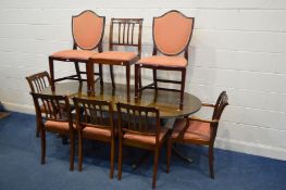 A MAHOGANY TWIN PEDESTAL DINING TABLE, one additional leaf, and six chairs together with two