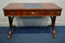 A REPRODUCTION MAHOGANY WRITING DESK, in the Regency style, with a blue leather and gilt tooled