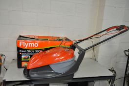 A FLYMO EASI GLIDE 300V ELECTRIC LAWN MOWER with original box (PAT pass and working)