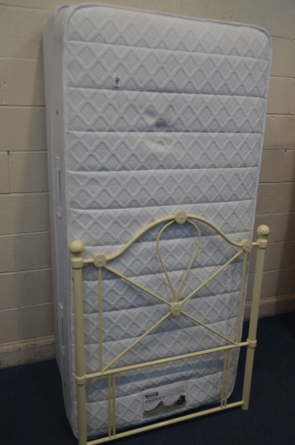 A SIMMONS SINGLE DIVAN BED, mattress and metal headboard