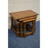 AN OLD CHARM OAK NEST OF THREE TABLES, largest table width 61cm x depth 33cm x height 46cm