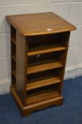 AN ERCOL GOLDEN DAWN ELM OPEN BOOKCASE, with side shelves, width 44cm x depth 39cm x height 79cm