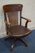 AN EARLY 20TH CENTURY OAK SWIVEL OFFICE OPEN ARMCHAIR