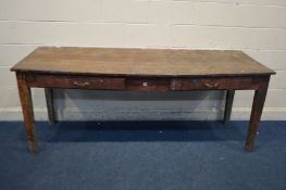 A LONG EARLY 20TH CENTURY OAK SLOPPED WRITING TABLE, with two drawers, length 206cm x depth 69cm x