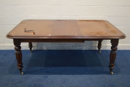 A REPRODUCTION VICTORIAN STYLE MAHOGANY WIND OUT DINING TABLE, two additional leaves, on bulbous