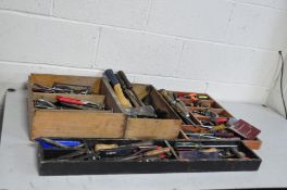 FOUR WOODEN TRAYS CONTAINING VINTAGE TOOLS including awls, chisels, gouges, files, etc