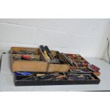 FOUR WOODEN TRAYS CONTAINING VINTAGE TOOLS including awls, chisels, gouges, files, etc