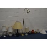 EIGHT VARIOUS TABLE LAMPS of various styles, materials and sizes, along with a brassed floor