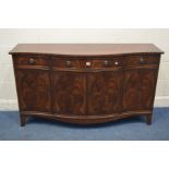 A REPRODUCTION MAHOGANY SERPENTINE SIDEBOARD, with three various drawers, on bracket feet, width