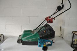 A QUALCAST TURBOVAC ELECTRIC LAWNMOWER with grass box (PAT pass and working) and a Black and