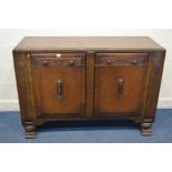 AN ART DECO CARVED OAK SIDEBOARD with two drawers, width 136cm x depth 50cm x height 92cm (missing