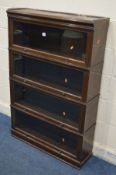 AN EARLY TO MID 20TH CENTURY OAK FOUR TIER SECTIONAL BOOKCASE, with glass fall front doors, width