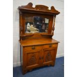 AN EDWARDIAN WALNUT MIRRORBACK SIDEBOARD with two drawers, width 120cm x depth 47cm x height 193cm x