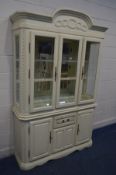 A CONTINENTAL CREAM FINISH DISPLAY CABINET, with two glass shelves, width 136cm x depth 41cm x