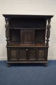 A CARVED OAK LIVERY CUPBOARD, incorporating timbers from the early 20th century or earlier, with