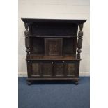 A CARVED OAK LIVERY CUPBOARD, incorporating timbers from the early 20th century or earlier, with
