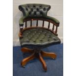 A BUTTONED GREEN LEATHER SWIVEL OFFICE CHAIR