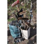 A GREEN WATER BUTT together with a folding sack truck, and a bin containing various garden tools