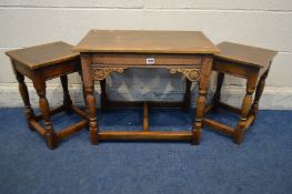 A REPRODUCTION OAK NEST OF THREE TABLES, width 61cm x depth 37cm x height 51cm (fluid damage and