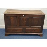 A GEORGIAN OAK MULE CHEST, with a panelled top, triple fielded panel front, above two drawers, width