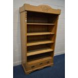 A PINE OPEN BOOKCASE above a single drawer, width 107cm x depth 60cm x height 200cm (converted