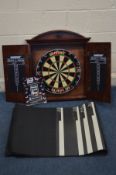 A MAHOGANY CASED TWO DOOR DARTS BOARD, along with a rubber darts mat (2)