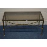 A RECTANGULAR BRASS AND SMOKED GLASS TOPPED COFFEE TABLE, on a cross stretchered base, length 91cm x