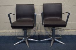 A PAIR OF CHROME AND BROWN LEATHER SALON/BARBERS SWIVEL CHAIRS, in a futuristic design, with a