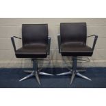 A PAIR OF CHROME AND BROWN LEATHER SALON/BARBERS SWIVEL CHAIRS, in a futuristic design, with a