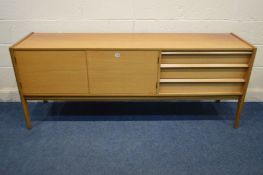 A YOUNGER TEAK SIDEBOARD, flanked by three drawers, the top drawer with cutlery dividers and