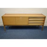 A YOUNGER TEAK SIDEBOARD, flanked by three drawers, the top drawer with cutlery dividers and