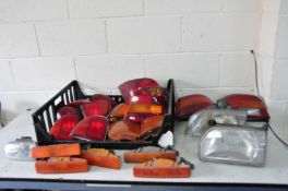 A TRAY CONTAINING VINTAGE FORD TAILLIGHTS , Indicators and headlights from Mk3 Fiesta, Mk4 Escort